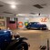 A car museum featuring a variety of vintage automobiles and gas station logos